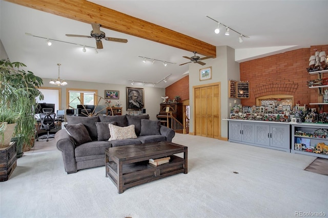 living room with light carpet, vaulted ceiling with beams, and ceiling fan with notable chandelier