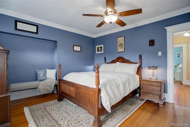 bedroom with ceiling fan, hardwood / wood-style floors, and ornamental molding