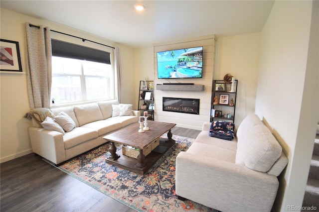 9 N Waterloo St, Aurora, CO 80018 - living room with wood finished floors, a glass covered fireplace, baseboards, and recessed lighting