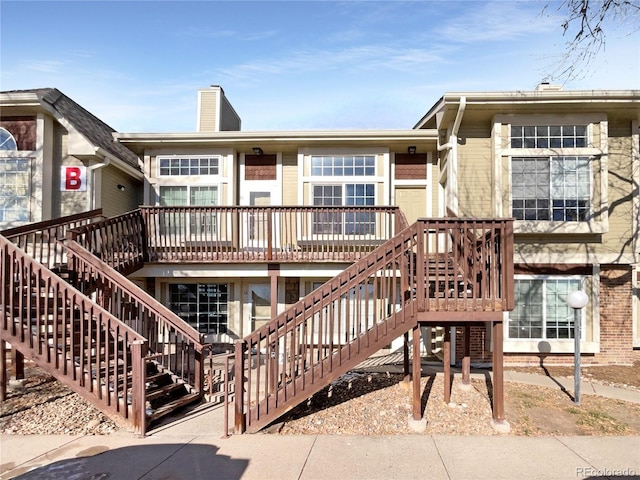 back of house featuring a deck