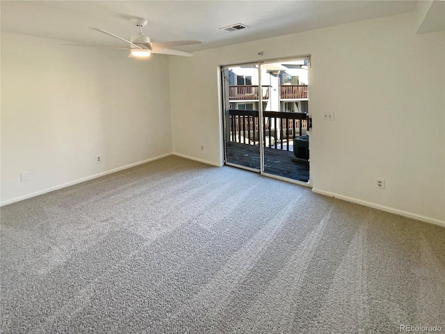 empty room with ceiling fan and carpet