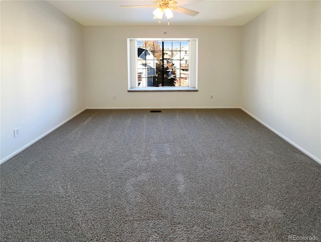 unfurnished room with ceiling fan and carpet floors