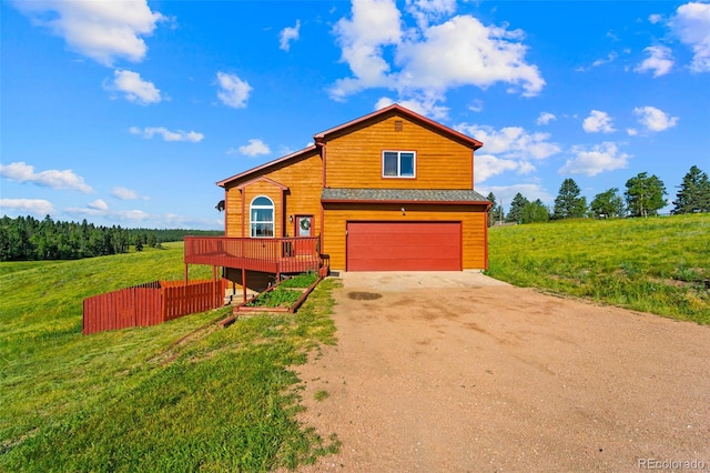 428 Ridge Dr, Divide, CO 80814 - view of front of property featuring driveway, a garage, and a front yard
