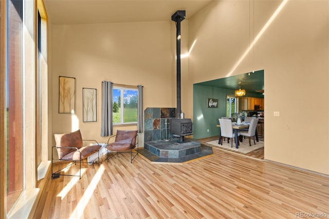428 Ridge Dr, Divide, CO 80814 - living room with a towering ceiling, a wood stove, and wood finished floors