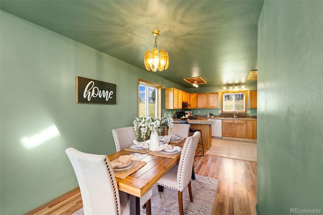 428 Ridge Dr, Divide, CO 80814 - dining space with a chandelier and light wood-style flooring