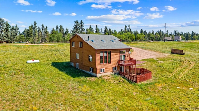428 Ridge Dr, Divide, CO 80814 - rear view of property with a yard, a wooden deck, and view of scattered trees