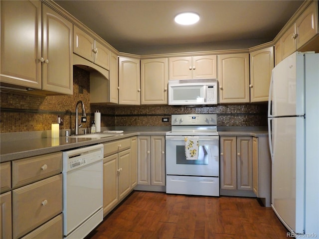 kitchen featuring white appliances, dark wood-style floors, backsplash, and a sink