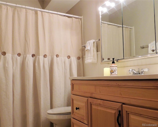 full bathroom featuring vanity and toilet