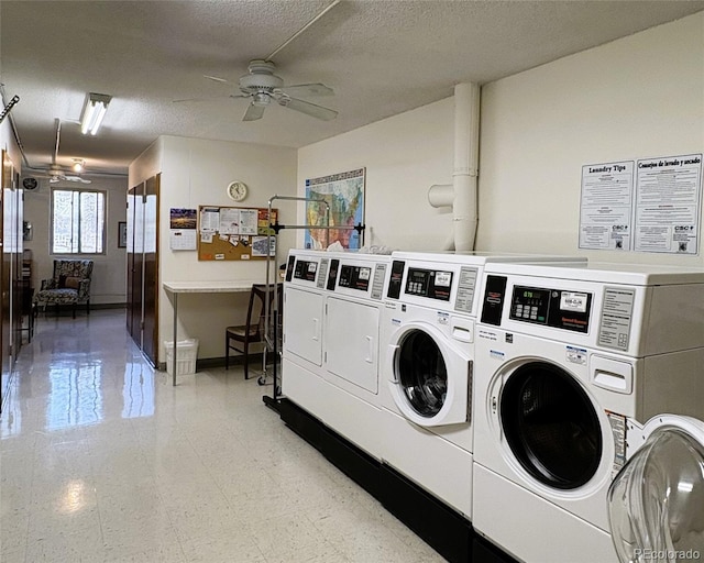 shared laundry area featuring a ceiling fan, baseboards, a textured ceiling, and washing machine and clothes dryer