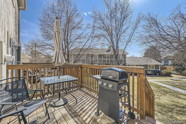 wooden deck featuring area for grilling