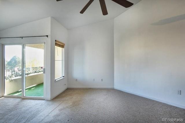 carpeted empty room featuring ceiling fan and lofted ceiling