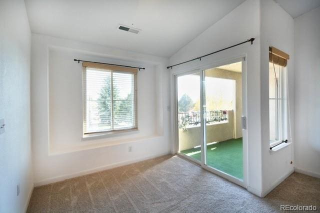3864 Riviera Grv Unit 204, Colorado Springs, CO 80922 - doorway with lofted ceiling, carpet flooring, baseboards, and visible vents