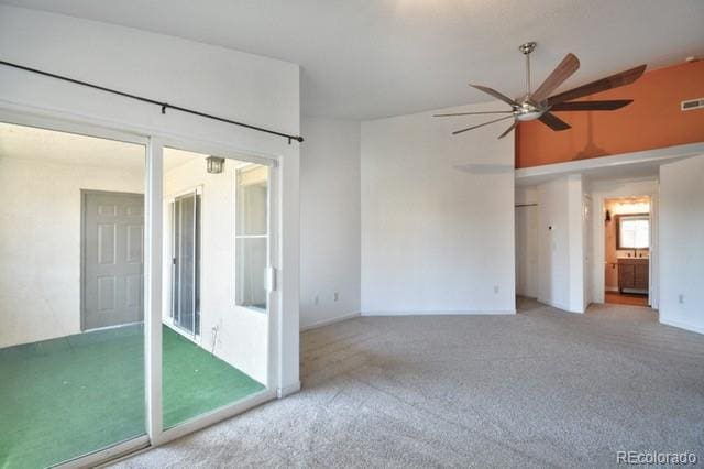 3864 Riviera Grv Unit 204, Colorado Springs, CO 80922 - carpeted empty room featuring vaulted ceiling, ceiling fan, baseboards, and visible vents