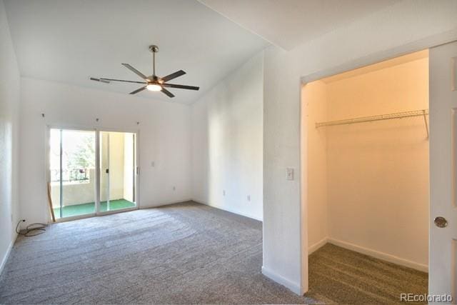 unfurnished bedroom with lofted ceiling and carpet flooring