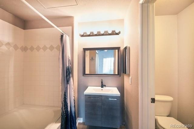 3864 Riviera Grv Unit 204, Colorado Springs, CO 80922 - full bathroom with toilet, vanity, and shower / bathtub combination with curtain