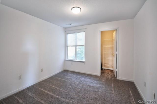 3864 Riviera Grv Unit 204, Colorado Springs, CO 80922 - unfurnished bedroom with carpet flooring and baseboards