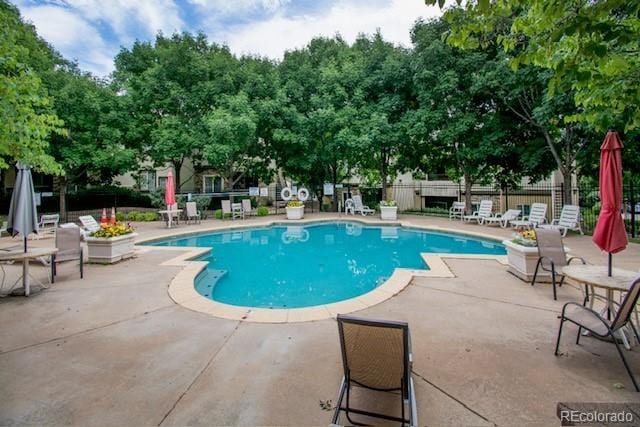 3864 Riviera Grv Unit 204, Colorado Springs, CO 80922 - view of pool featuring a patio, fence, and a fenced in pool