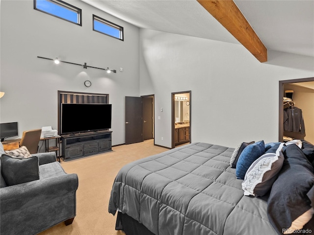 bedroom with light carpet, ensuite bath, high vaulted ceiling, and beam ceiling