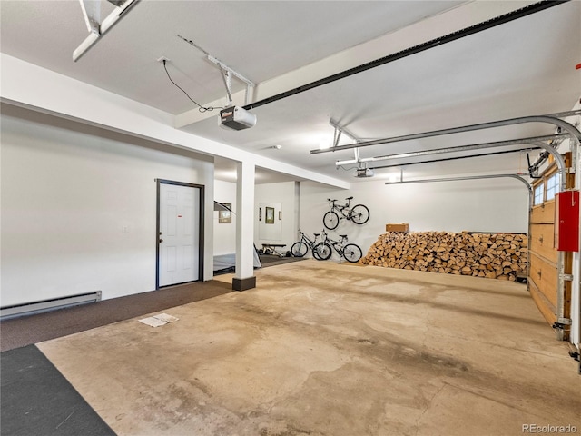 garage with a garage door opener and a baseboard radiator