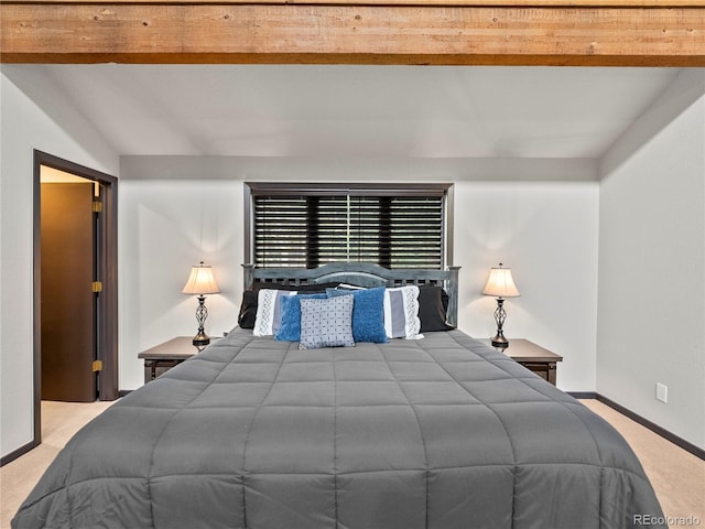 carpeted bedroom featuring vaulted ceiling with beams and baseboards