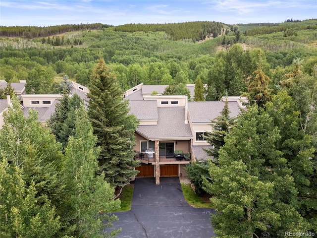 drone / aerial view with a view of trees