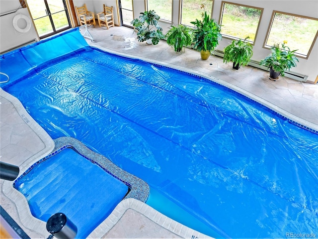 indoor pool with a patio