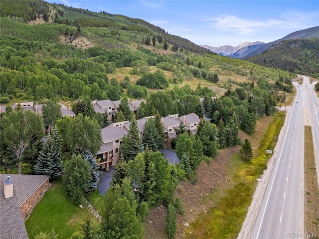 aerial view featuring a mountain view and a view of trees