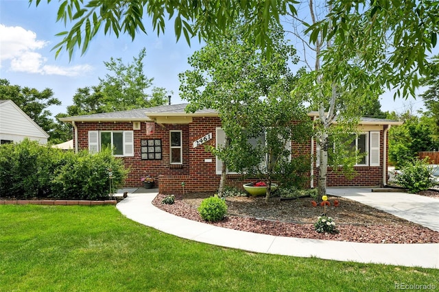 2461 Niagara St, Denver, CO 80207 - view of front of house with brick siding and a front lawn