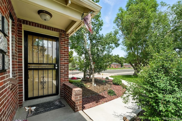 2461 Niagara St, Denver, CO 80207 - view of exterior entry featuring brick siding