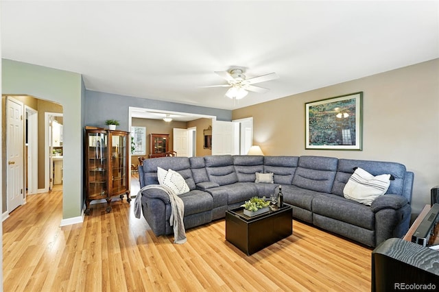 2461 Niagara St, Denver, CO 80207 - living room with light wood finished floors and ceiling fan