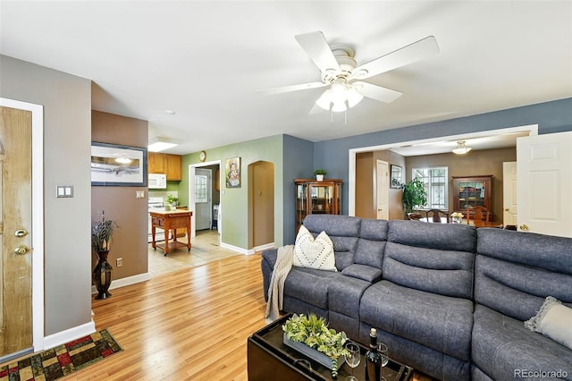 2461 Niagara St, Denver, CO 80207 - living area with ceiling fan and light wood-style flooring
