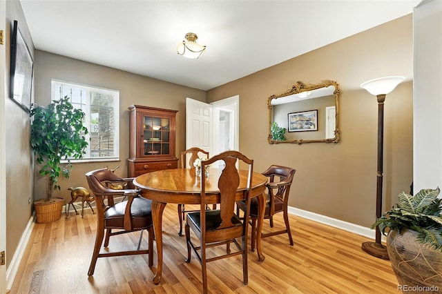 2461 Niagara St, Denver, CO 80207 - dining area featuring light wood finished floors and baseboards