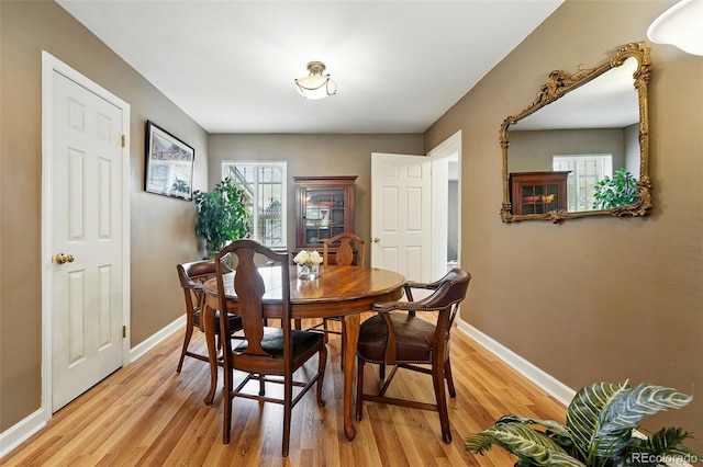 2461 Niagara St, Denver, CO 80207 - dining area with baseboards and light wood-style floors