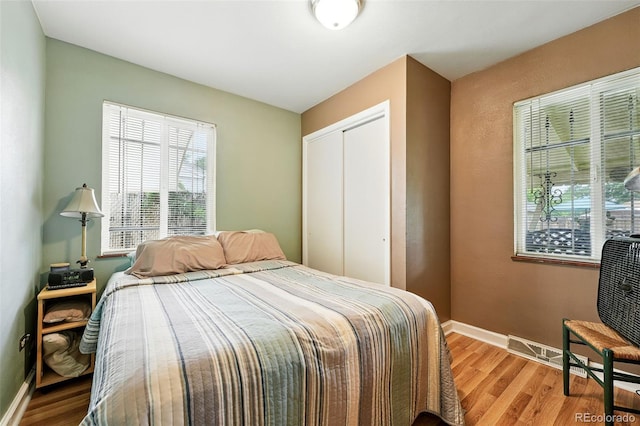 2461 Niagara St, Denver, CO 80207 - bedroom with light wood-style floors and a closet