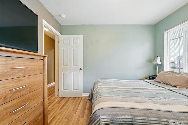 2461 Niagara St, Denver, CO 80207 - bedroom featuring light wood-style flooring and baseboards