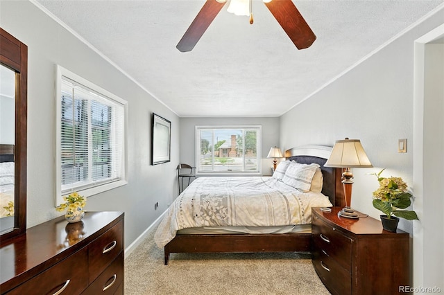 2461 Niagara St, Denver, CO 80207 - carpeted bedroom with crown molding and ceiling fan