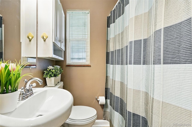 2461 Niagara St, Denver, CO 80207 - full bathroom with a sink and curtained shower
