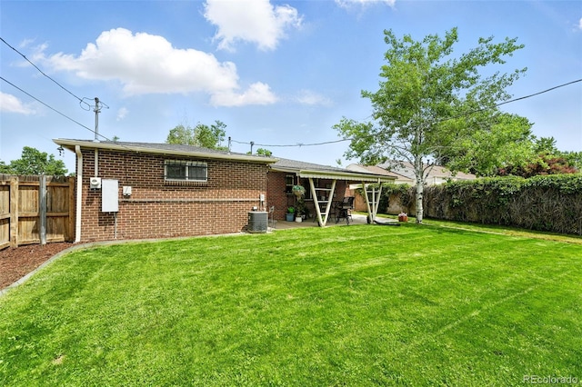 2461 Niagara St, Denver, CO 80207 - back of house with a fenced backyard, brick siding, and a patio