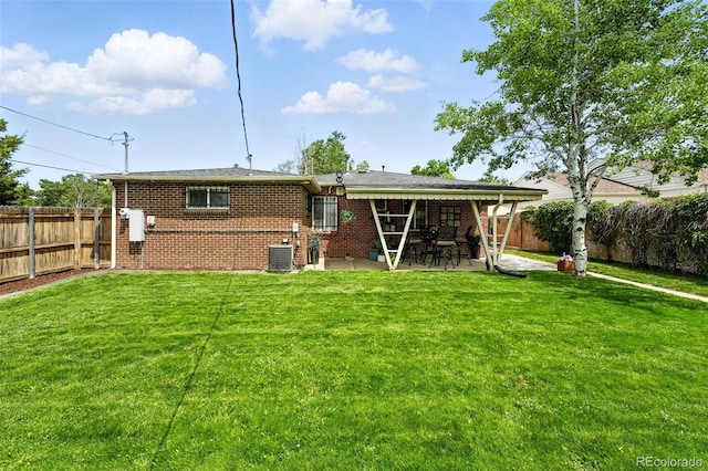 2461 Niagara St, Denver, CO 80207 - back of property featuring a patio, brick siding, and a fenced backyard
