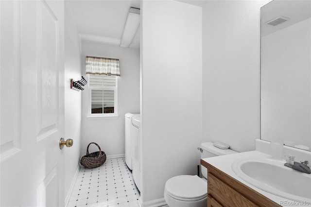 bathroom featuring toilet and vanity