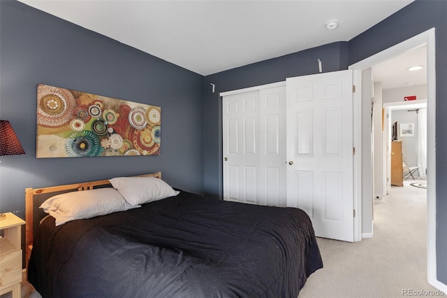 carpeted bedroom featuring a closet