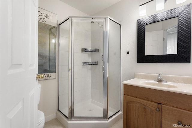 bathroom with vanity and a shower with shower door