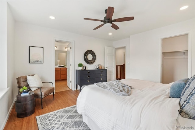 8926 Swan River St, Littleton, CO 80125 - bedroom with wood finished floors, ceiling fan, recessed lighting, ensuite bath, and a spacious closet