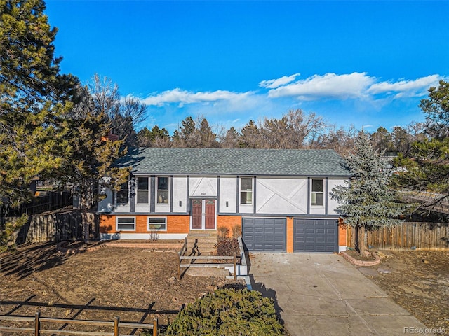 split foyer home featuring french doors and a garage