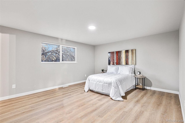 bedroom with light hardwood / wood-style flooring