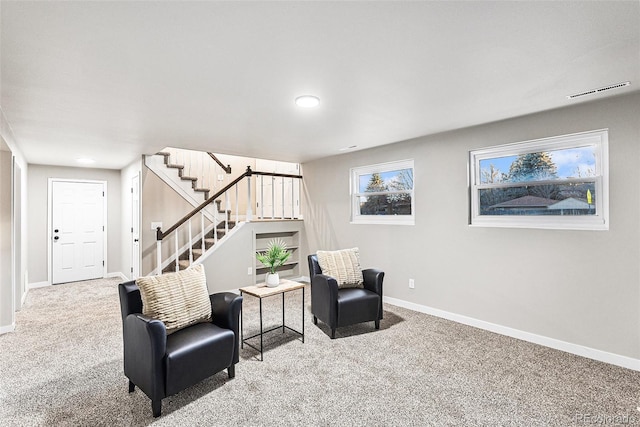 living area featuring carpet