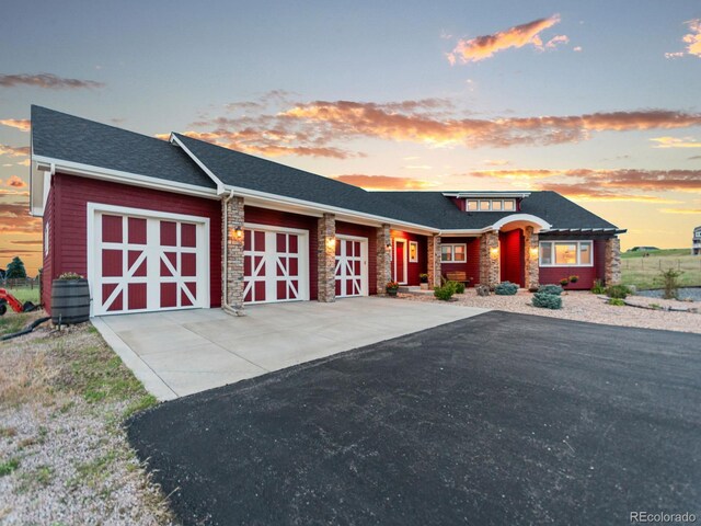 3124 Antelope Ridge Trl, Parker, CO 80138 - view of front of property with a garage, driveway, and stone siding