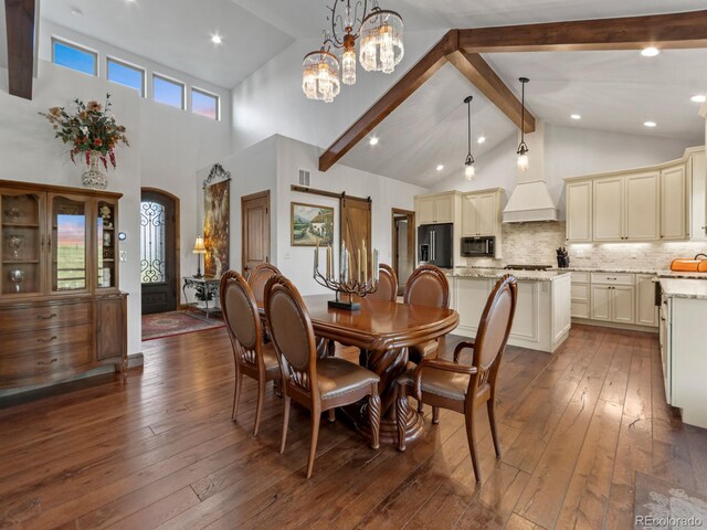3124 Antelope Ridge Trl, Parker, CO 80138 - dining area with dark wood finished floors, high vaulted ceiling, beamed ceiling, and a chandelier