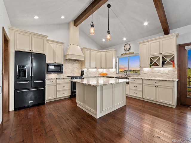 3124 Antelope Ridge Trl, Parker, CO 80138 - kitchen with black appliances, cream cabinetry, dark wood-style floors, light stone countertops, and recessed lighting