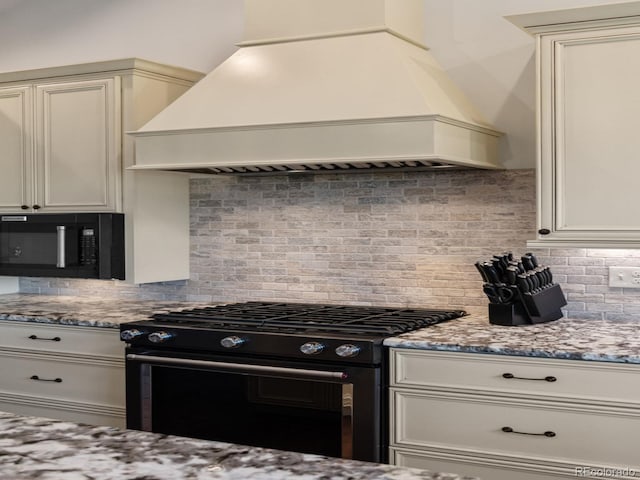 3124 Antelope Ridge Trl, Parker, CO 80138 - kitchen with custom exhaust hood, black appliances, decorative backsplash, and light stone counters